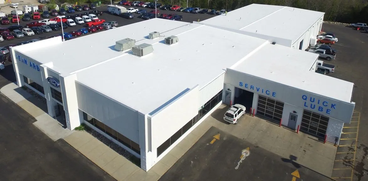 Aerial view of a completed white Duro-Last roof on a commercial building