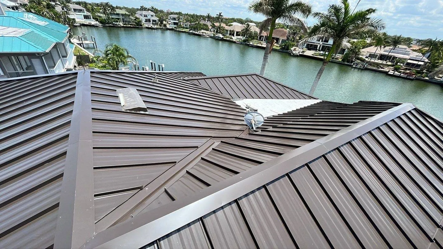Brown standing seam metal roof on a Florida canal home