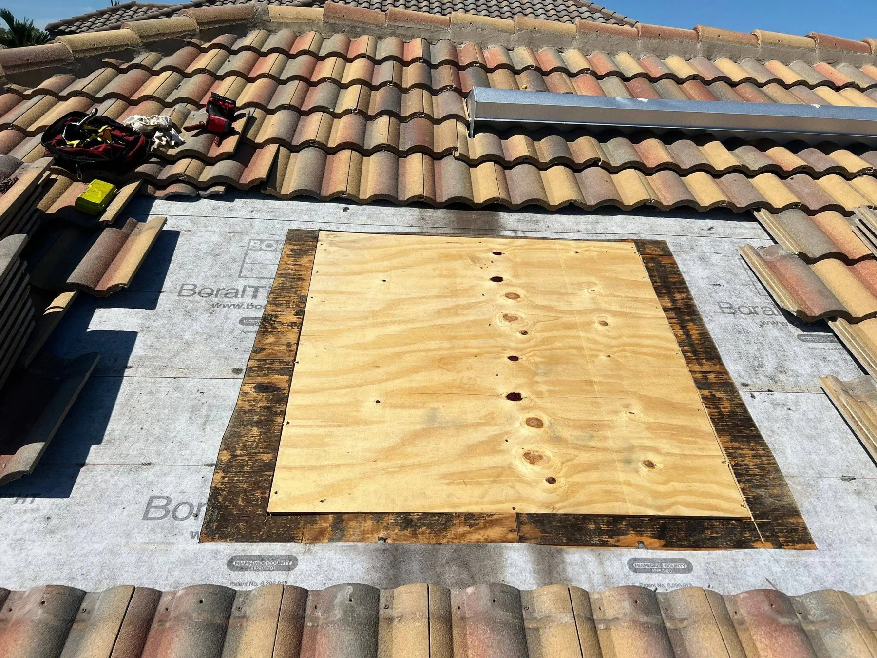 Tile roof repair with new decking after storm damage